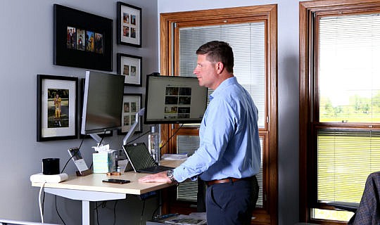 Sean White working at his standing desk